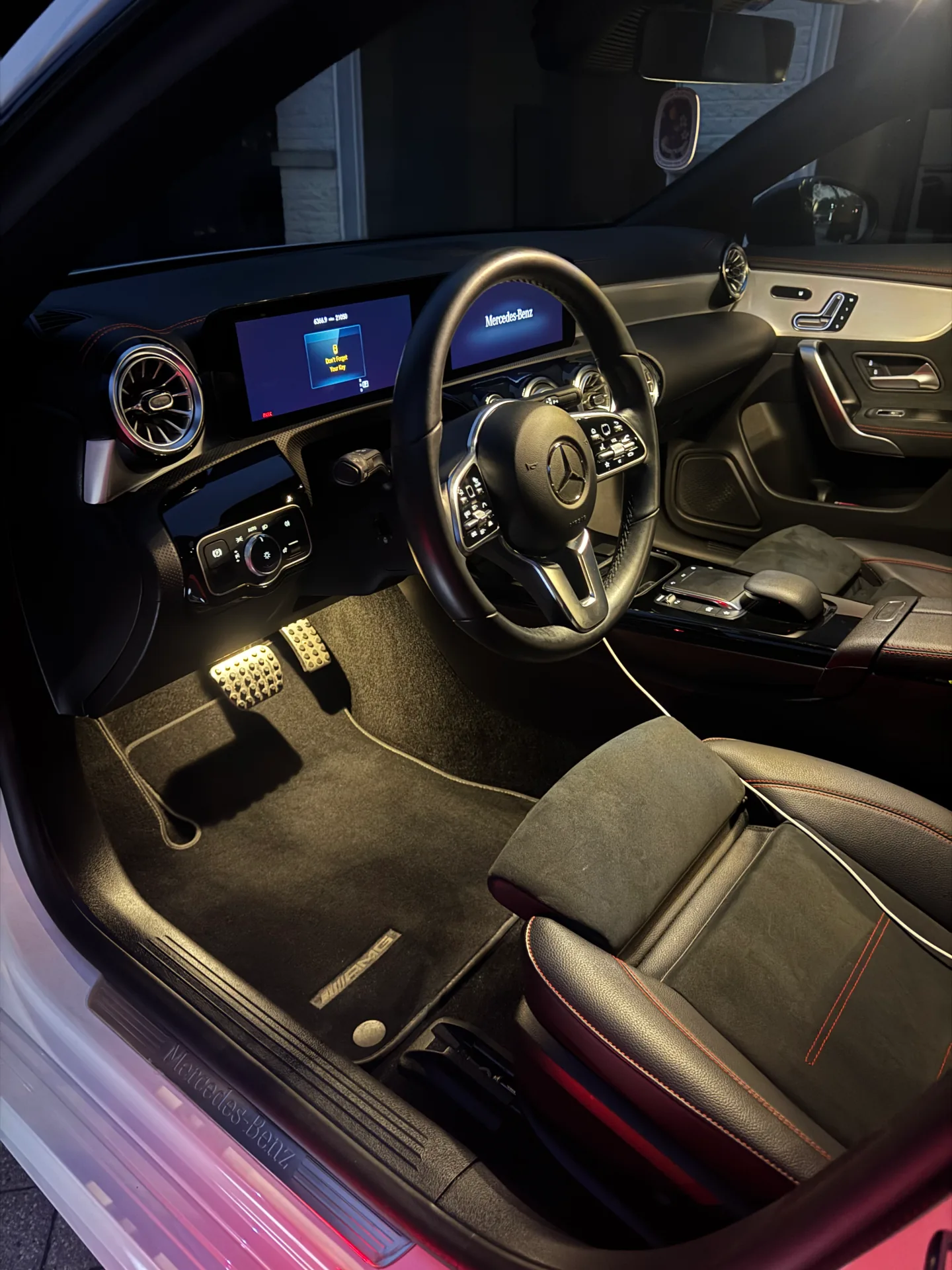 Mercedes-AMG interior with lit dash screens after an interior detail