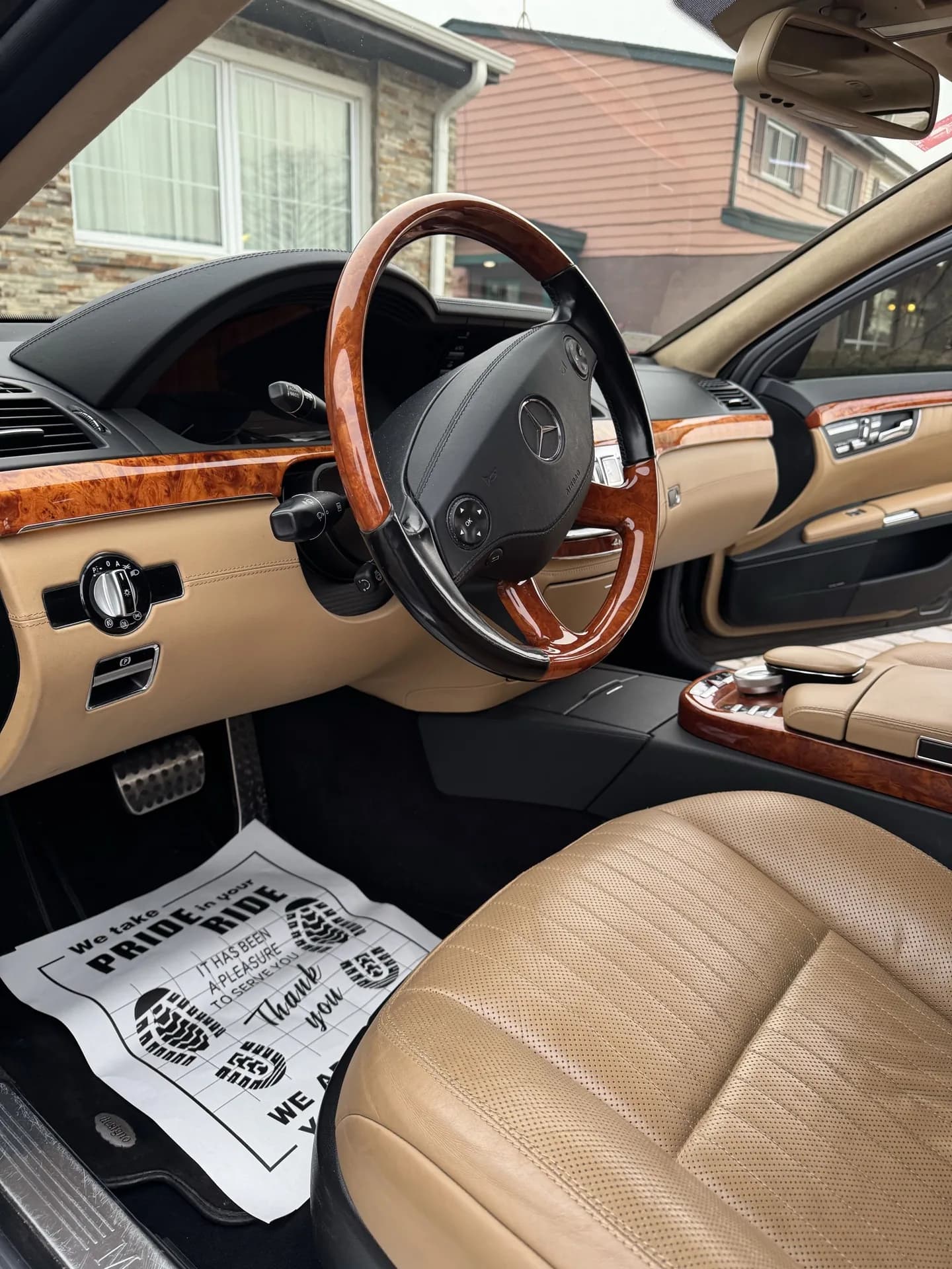 Mercedes S-Class tan leather interior with burl wood trim after detailing