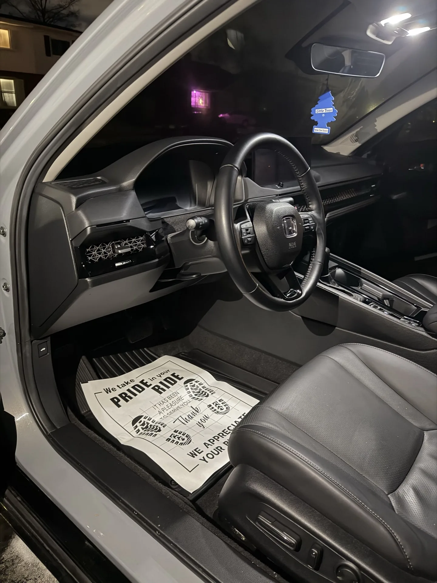 Honda interior with black leather freshly detailed at night
