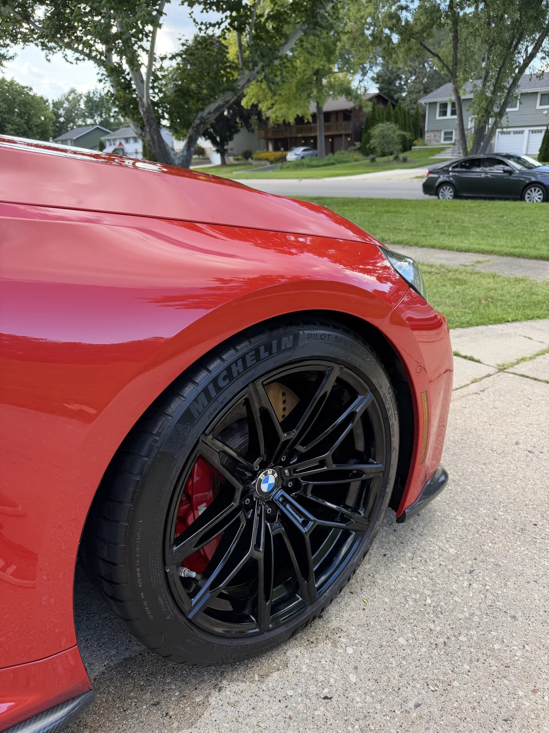 Close-up of a red BMW M4 after an exterior detail