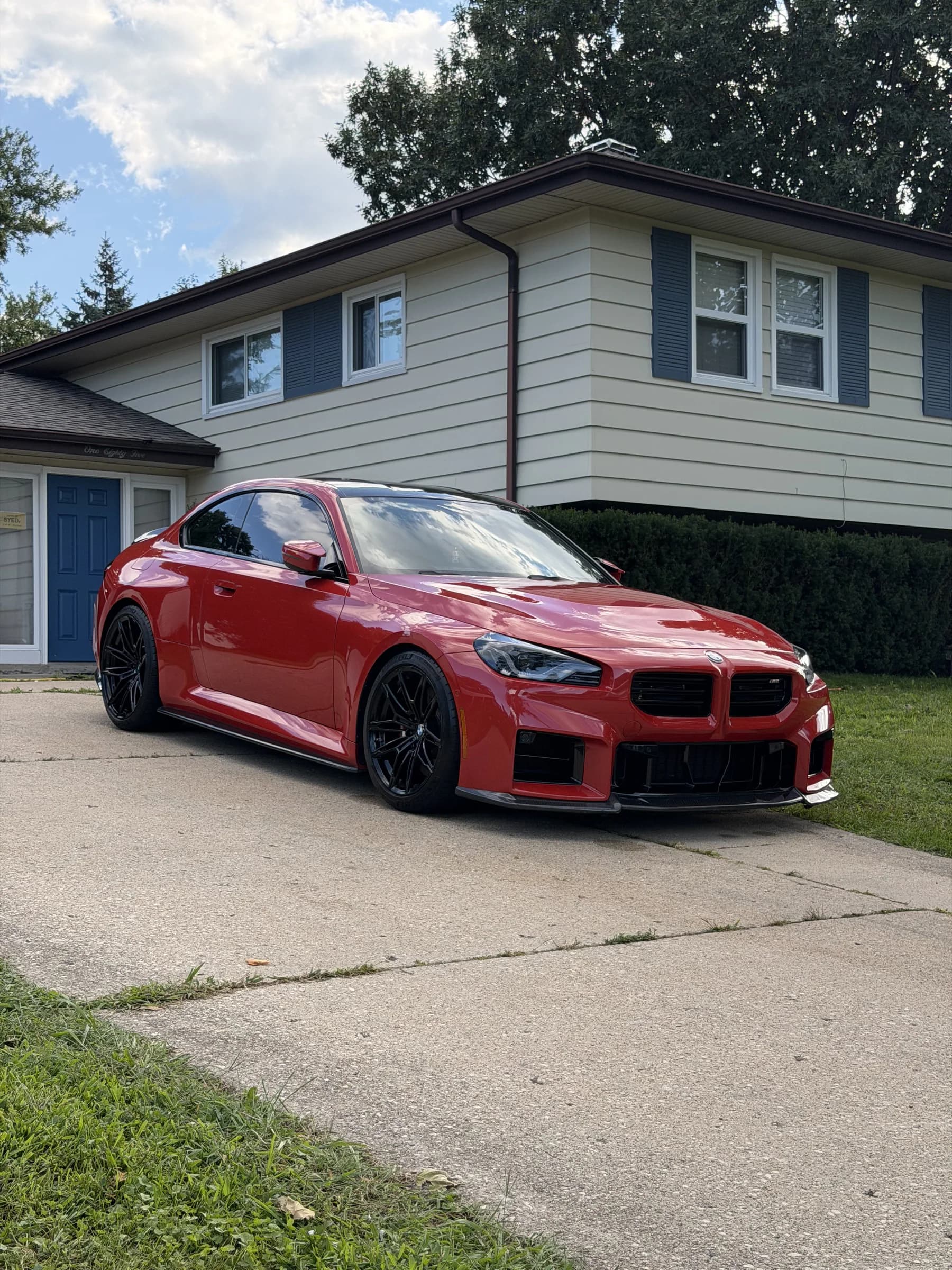 Red BMW M4 after an exterior detail