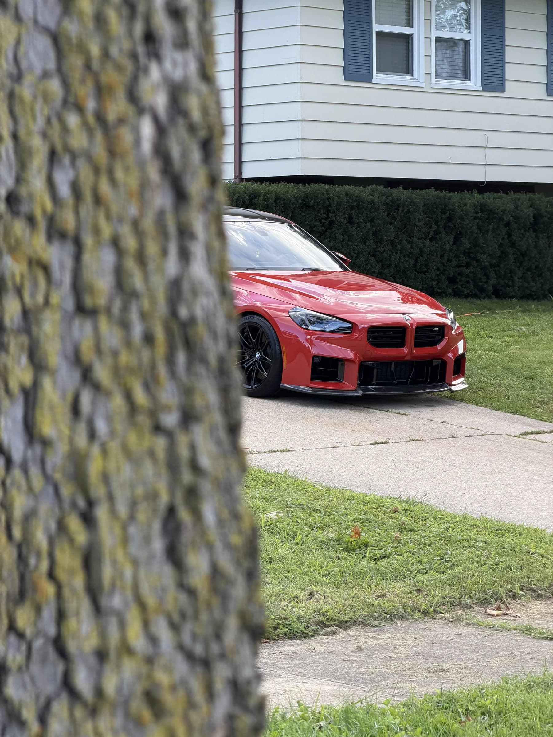 Red BMW M4 after an exterior detail