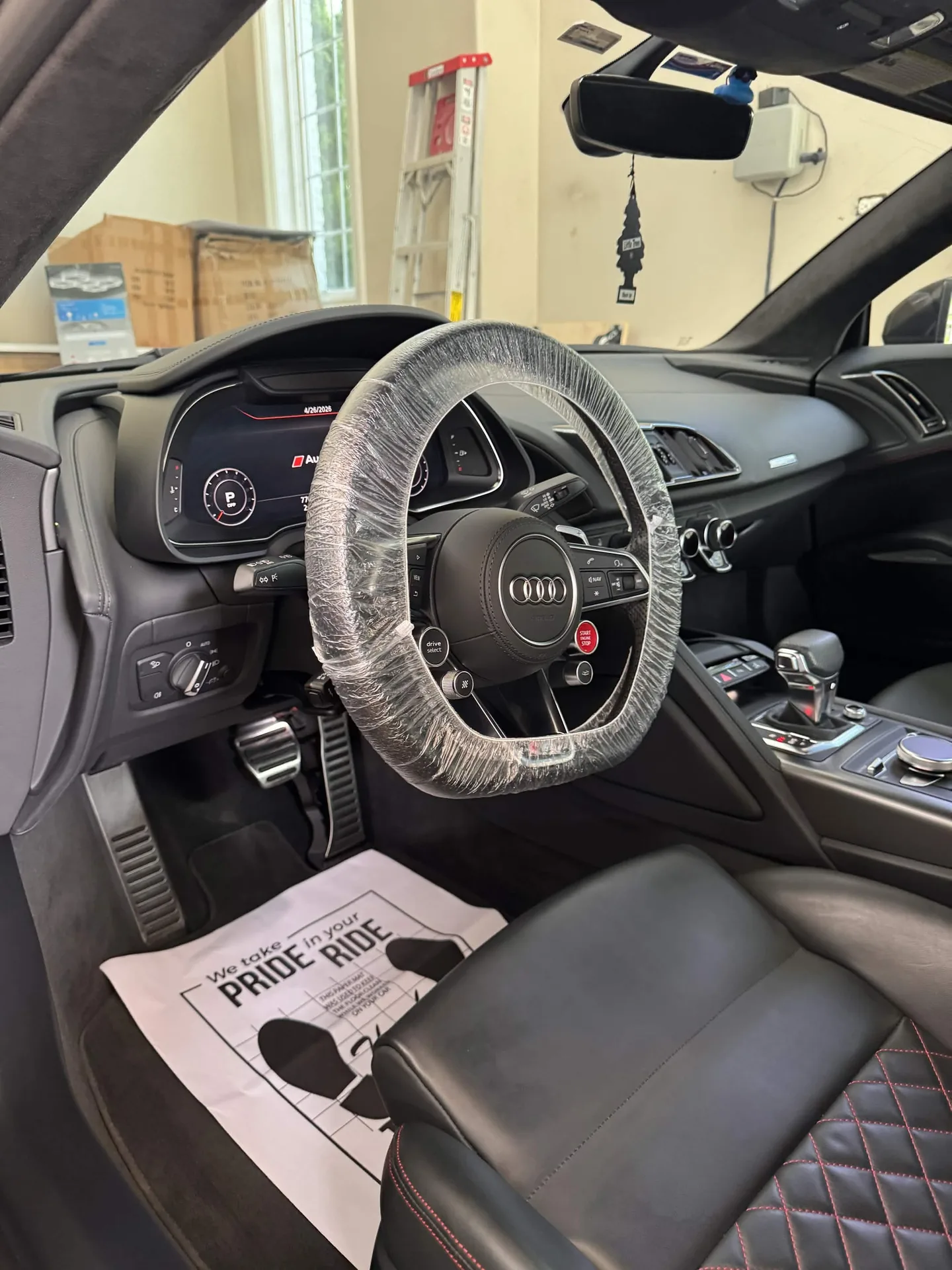 Audi R8 cockpit with protected steering wheel after an interior detail